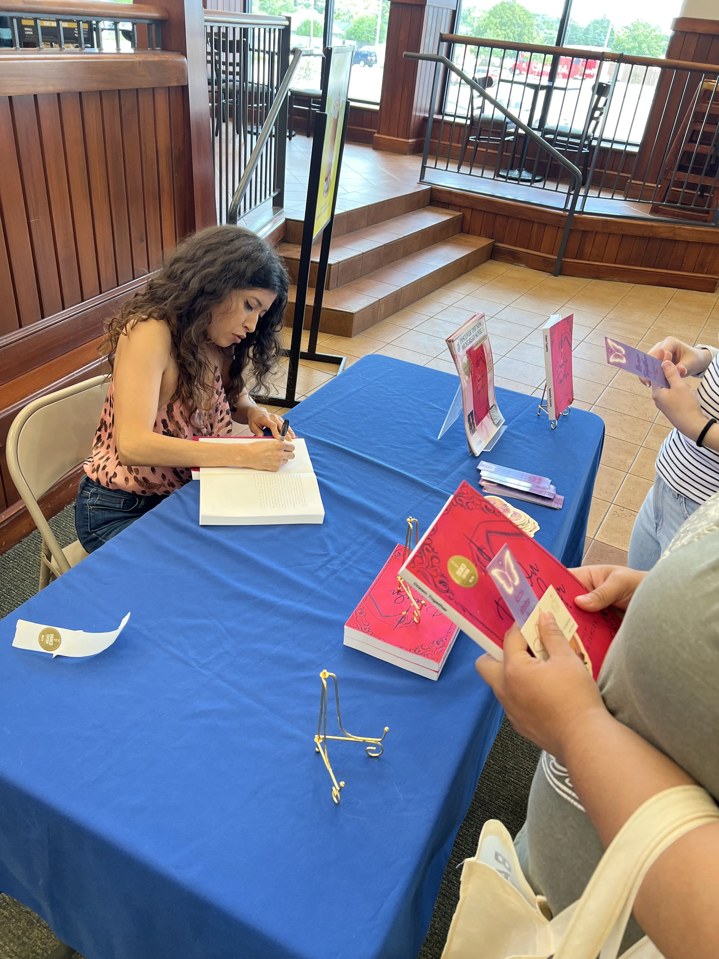 Signing copies of Drawn Together during Samantha Zamora's Barnes & Noble author event.