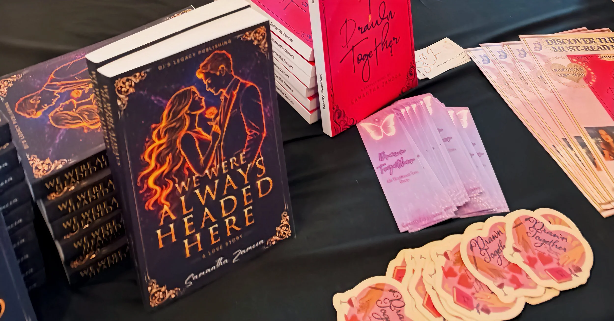 Copies of Samantha Zamora's novels We Were Always Headed Here and Drawn Together displayed at her Barnes & Noble signing.