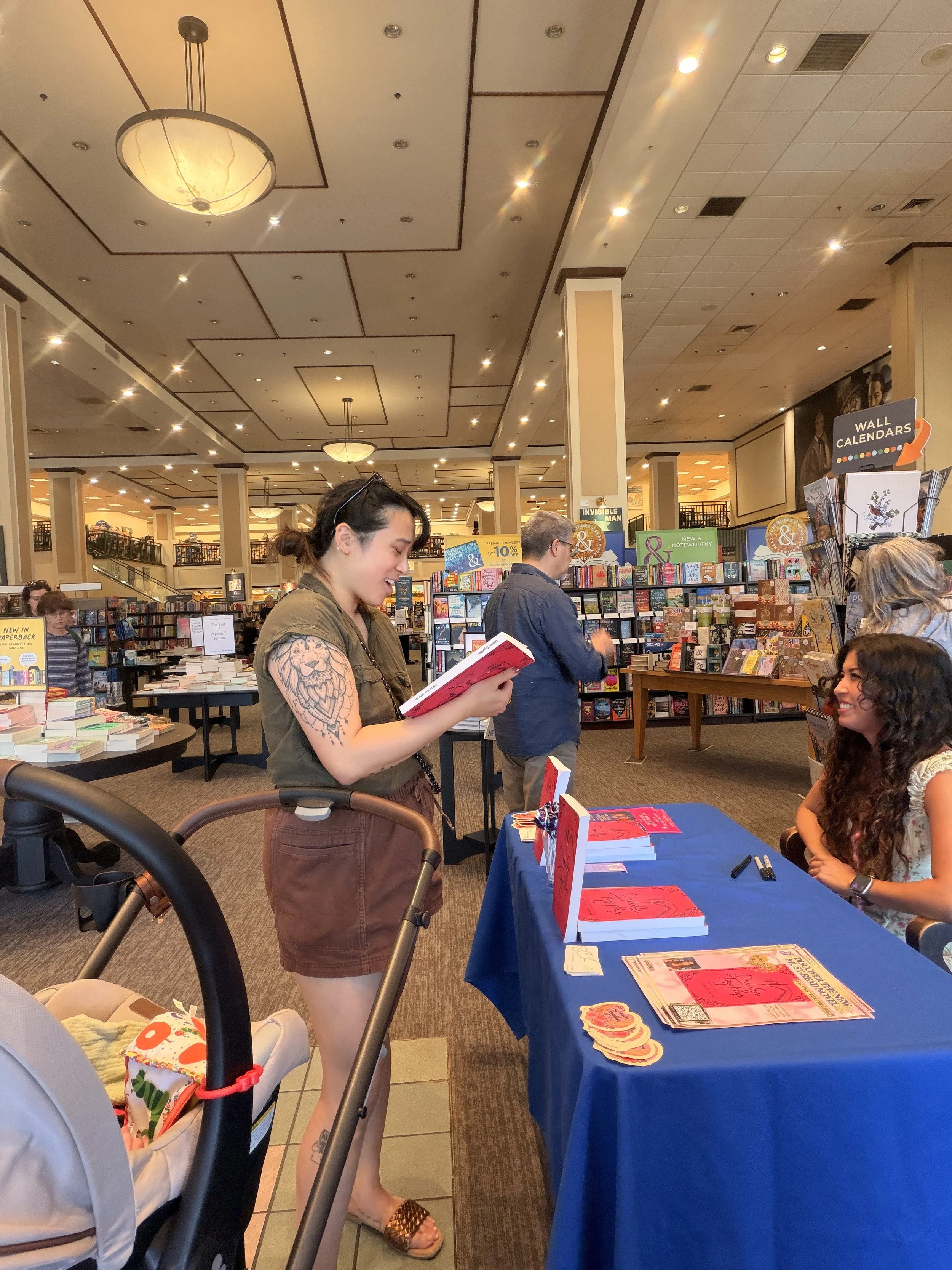 Samantha Zamora talking with a reader about her books during her Barnes & Noble signing at The Promenade at Westlake.