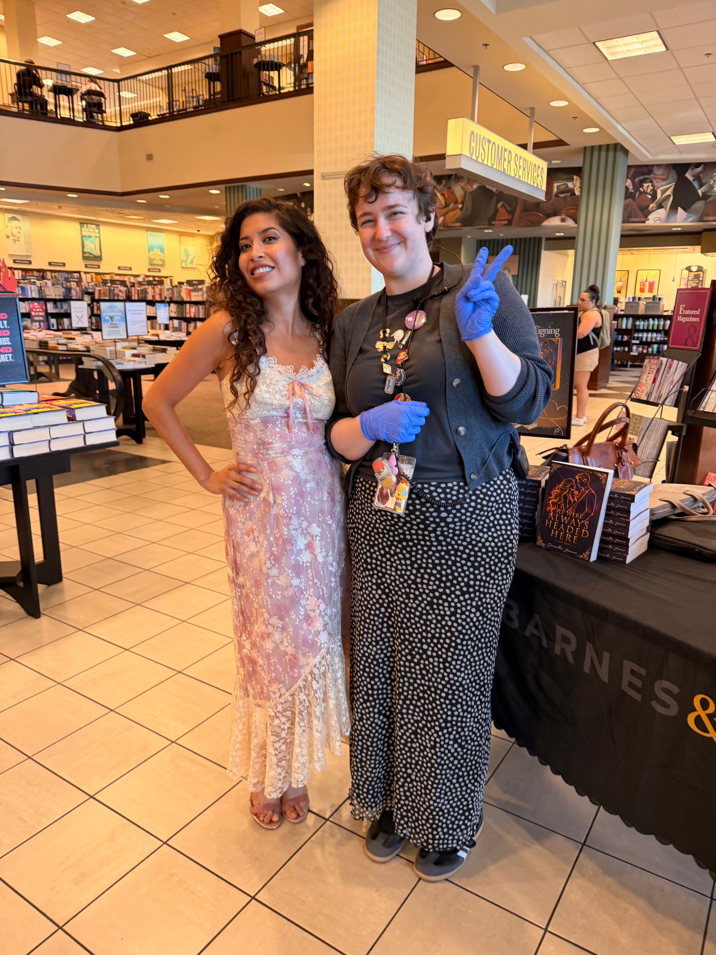 Samantha Zamora with a Barnes & Noble event host at her Torrance, California book signing featuring We Were Always Headed Here and Drawn Together.
