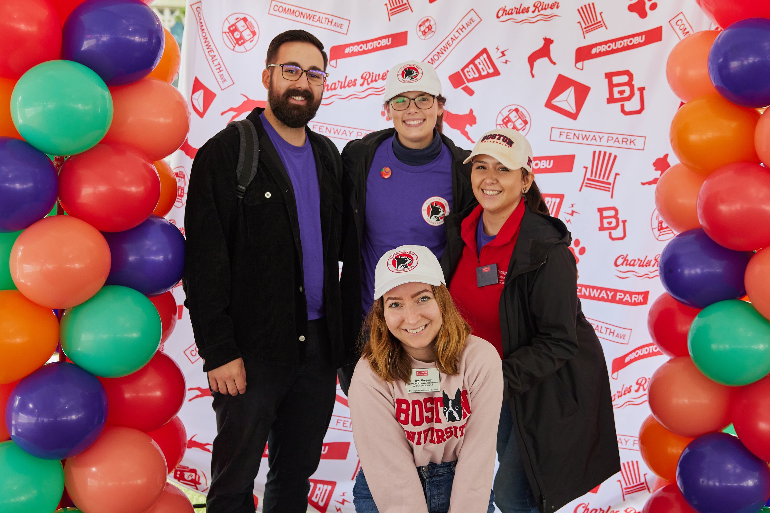 2023 step and repeat backdrop, featuring 2023 baseball caps and staff t-shirts (purple)