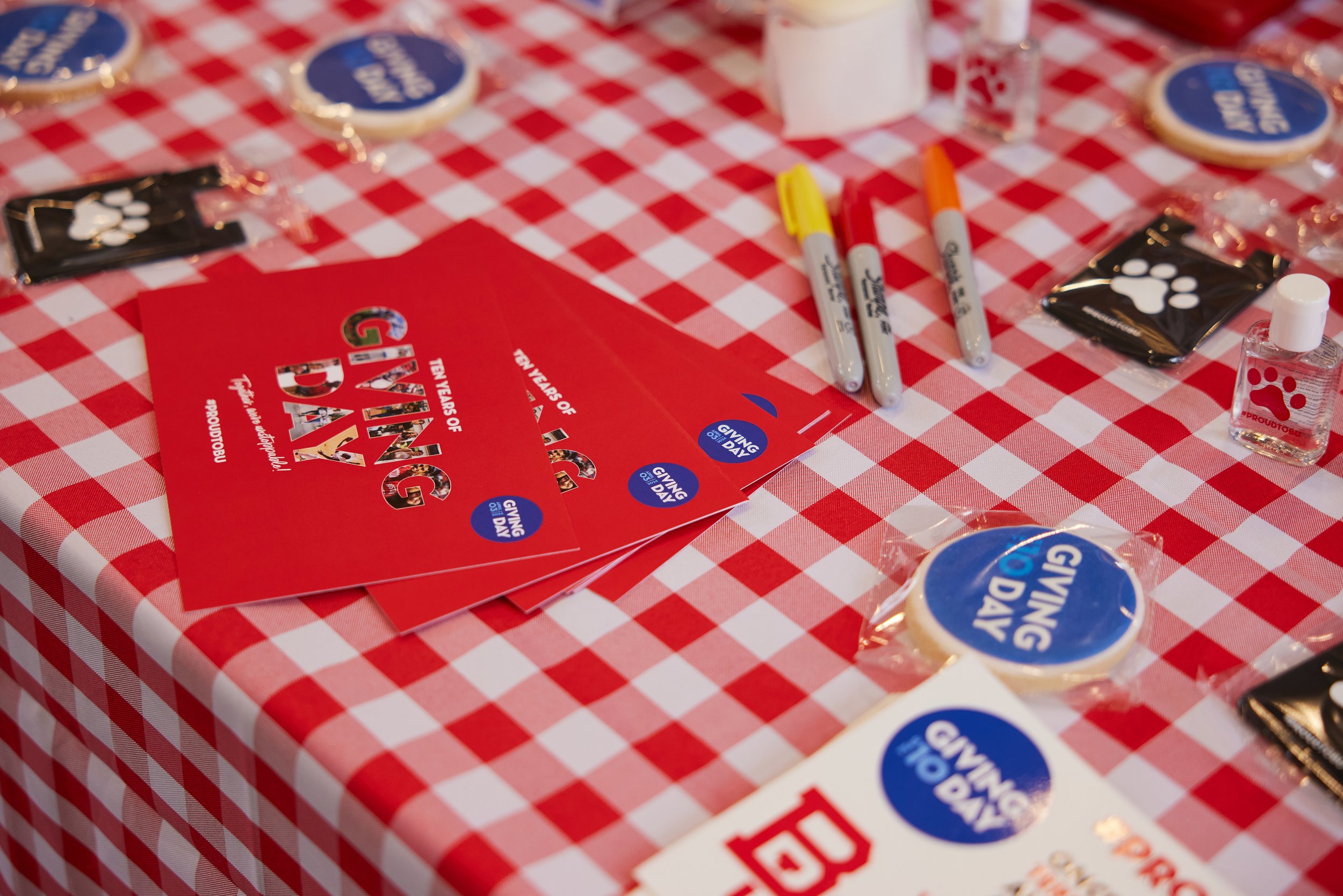 2024 postcard handout, sticker sheet, cookies, and phone wallets