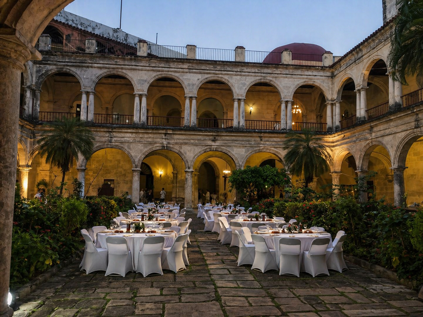 white-folding-chairs-colonial-courtyard-event-setup.webp