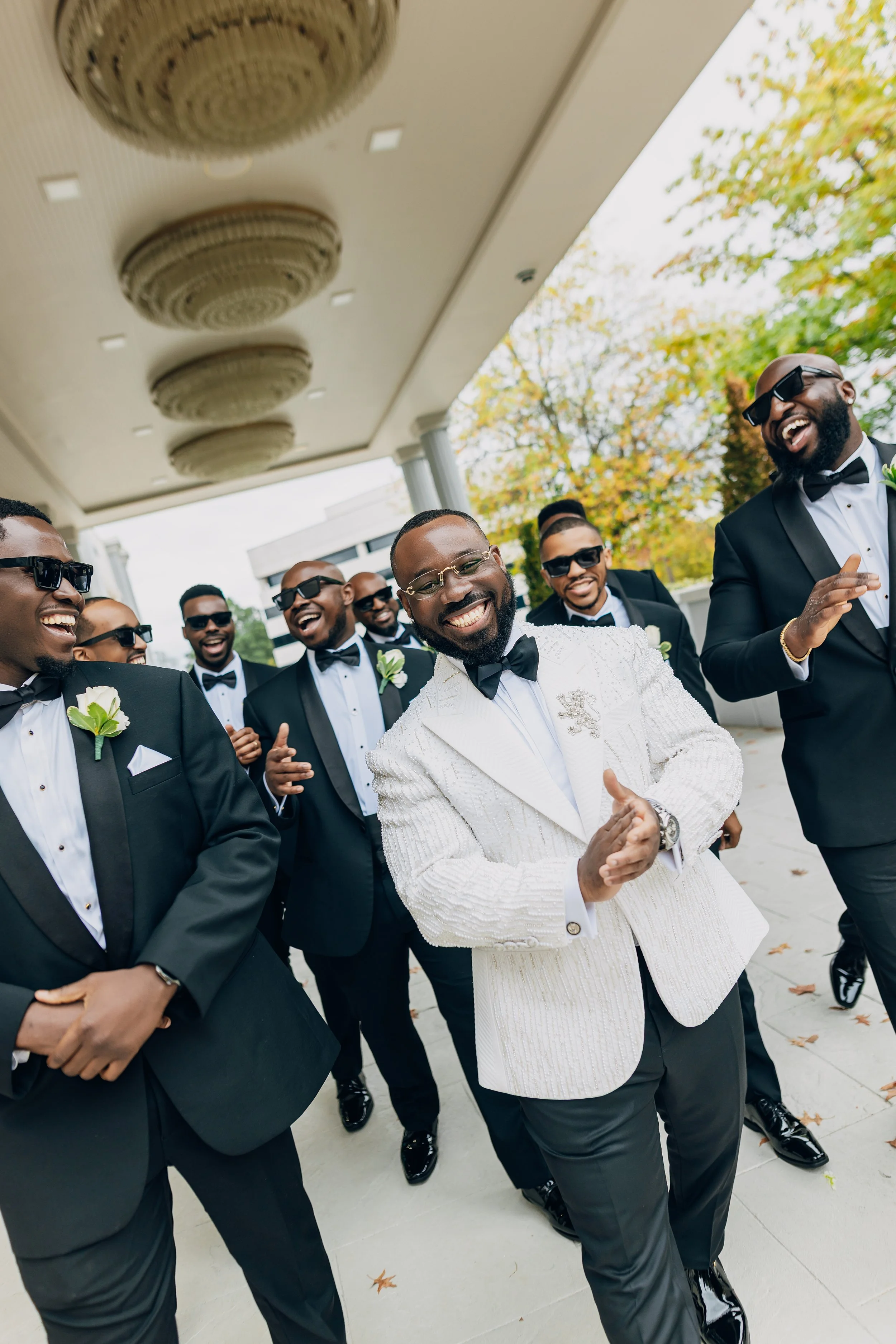 Editorial-style wedding photography of  groom and groomsmen in Washington DC