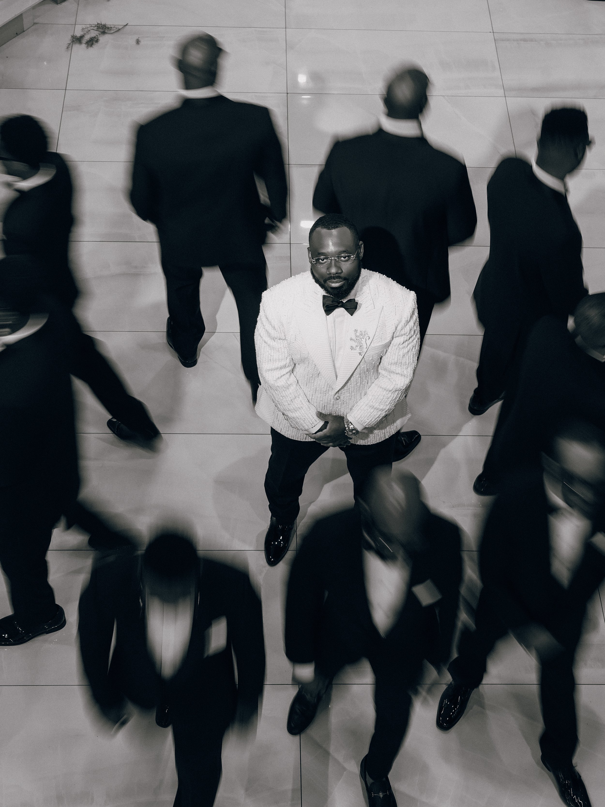 Editorial-style wedding photography of  groom and groomsmen in Washington DC