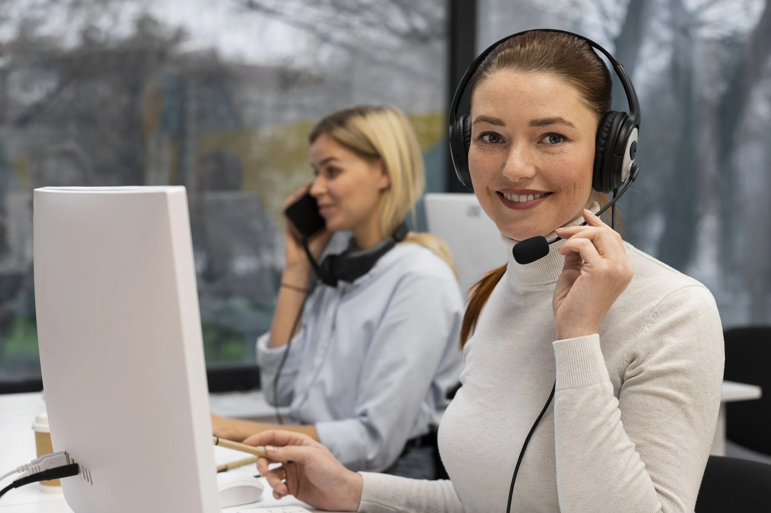 woman-working-call-center-talking-with-clients-using-headphones-microphone.jpg