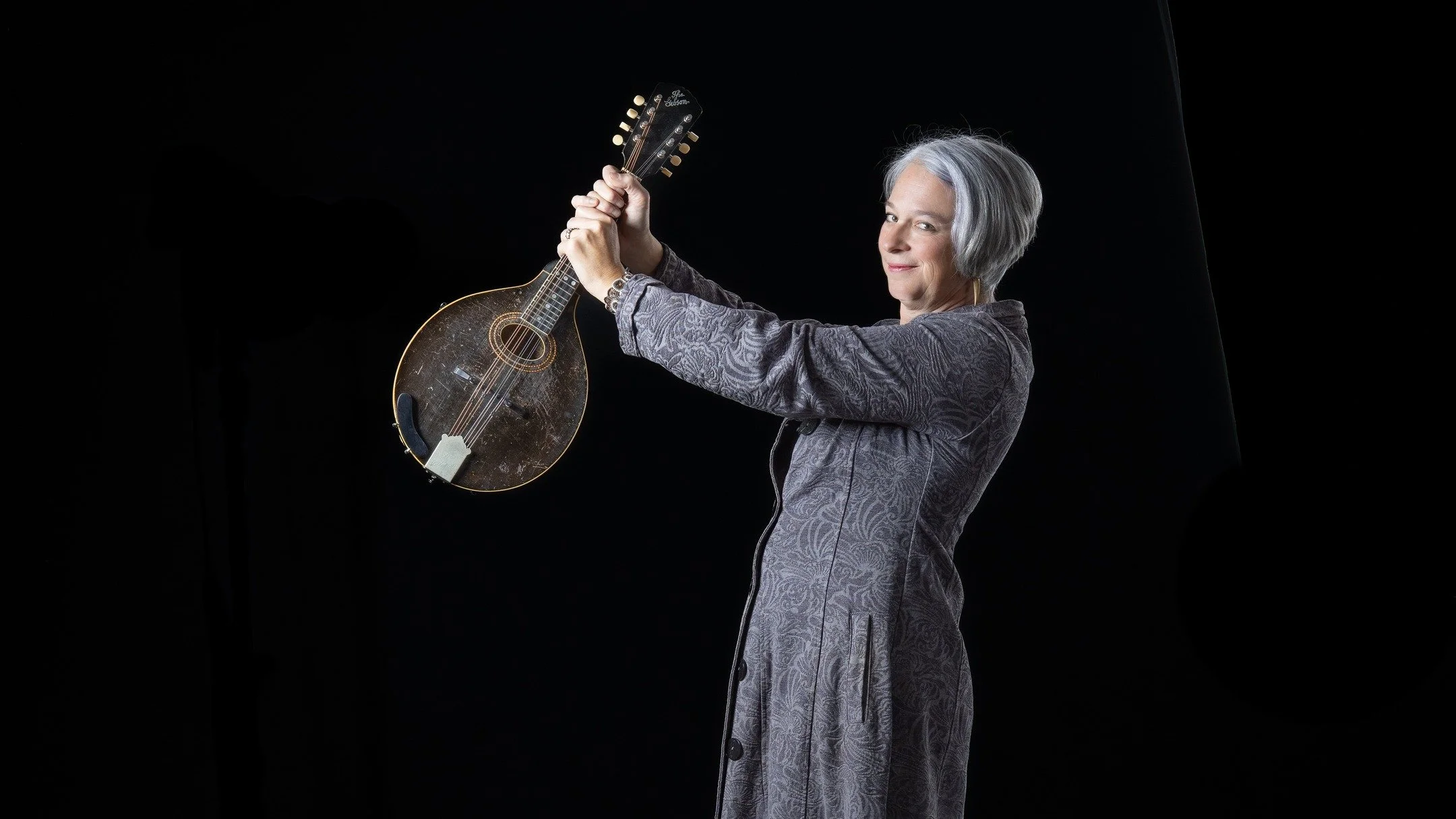 Luthier and musician, Anna Sandys and I spent time this morning in Becker Canyon Studio. I was able to admire her wonderful handiwork and this Gibson mandolin dating to the 1920s. Anna brought along the brocade topcoat, which proved to be perfect com