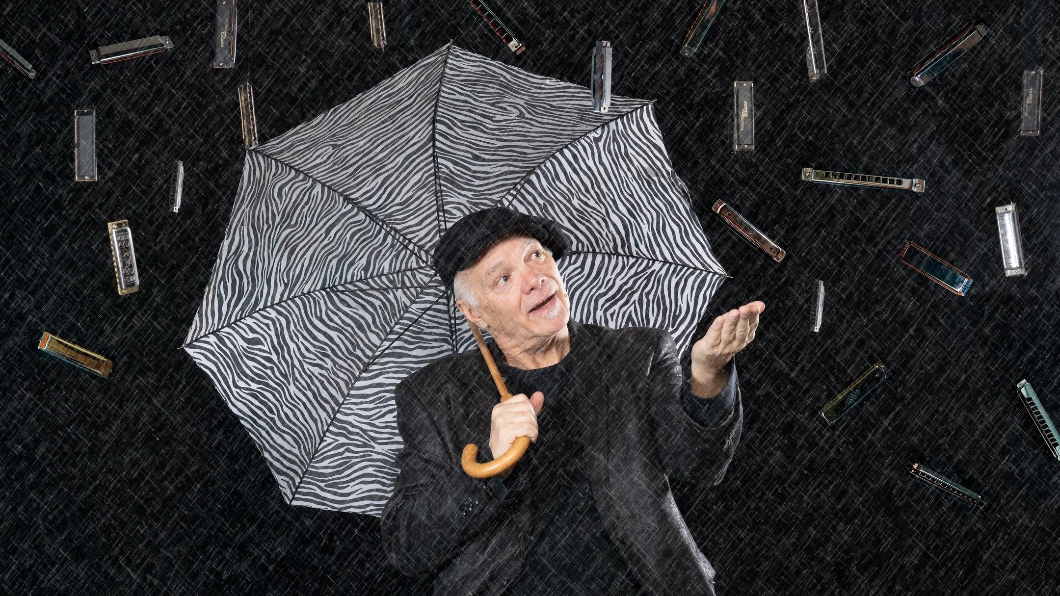 I saw Curtis Salgado at the Alberta Rose Theatre about a month ago. I was shooting the show and Curtis was there to check it out. The result of our chance meeting is this image of Curtis with raining harmonicas. The concept was Curtis' and the photo 