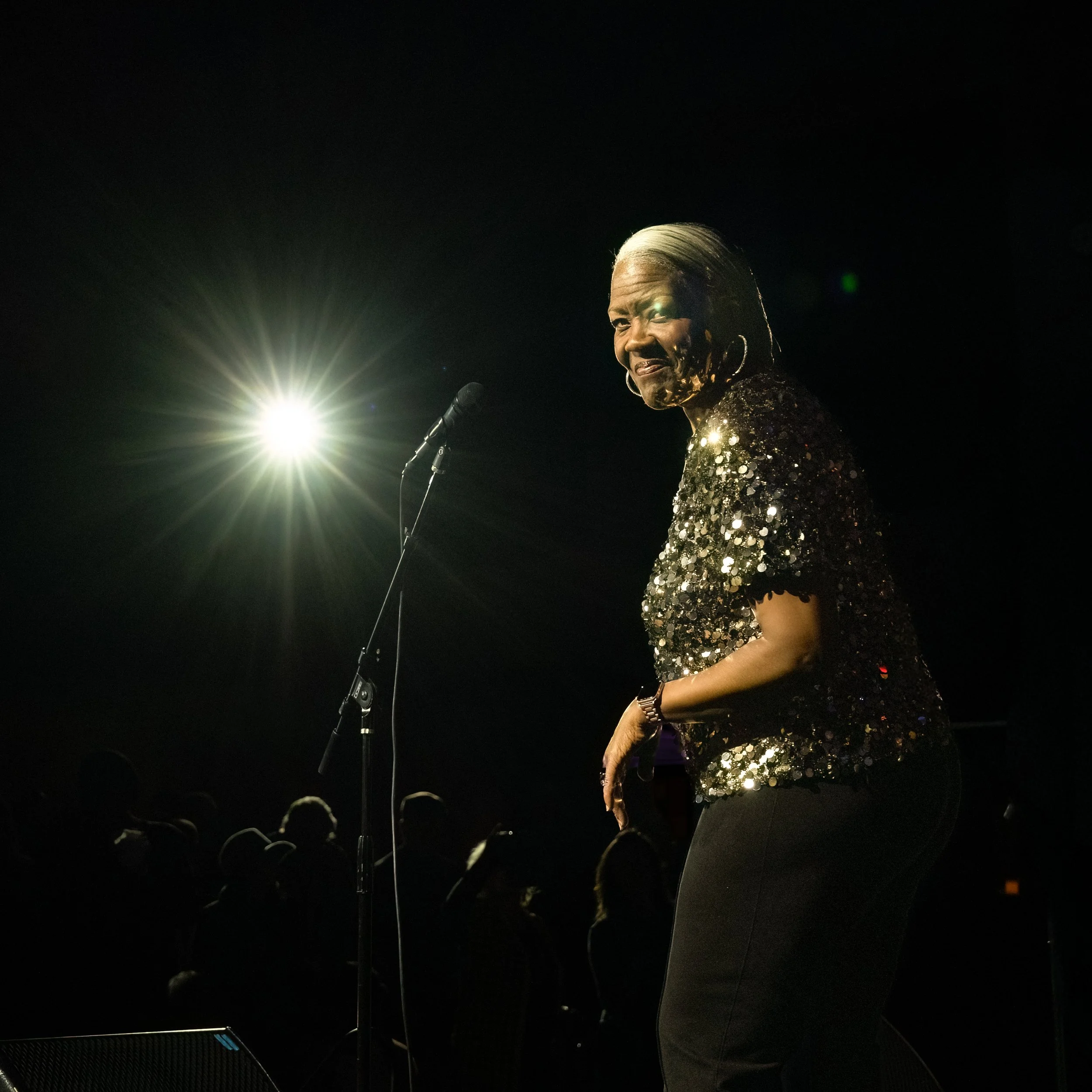 A lot of magic happens during a performance but on rare occasion that moment is an intimate look between the artist on stage and a photographer. The moments go unnoticed by the audience and are mostly missed by the photographer's camera. This image o