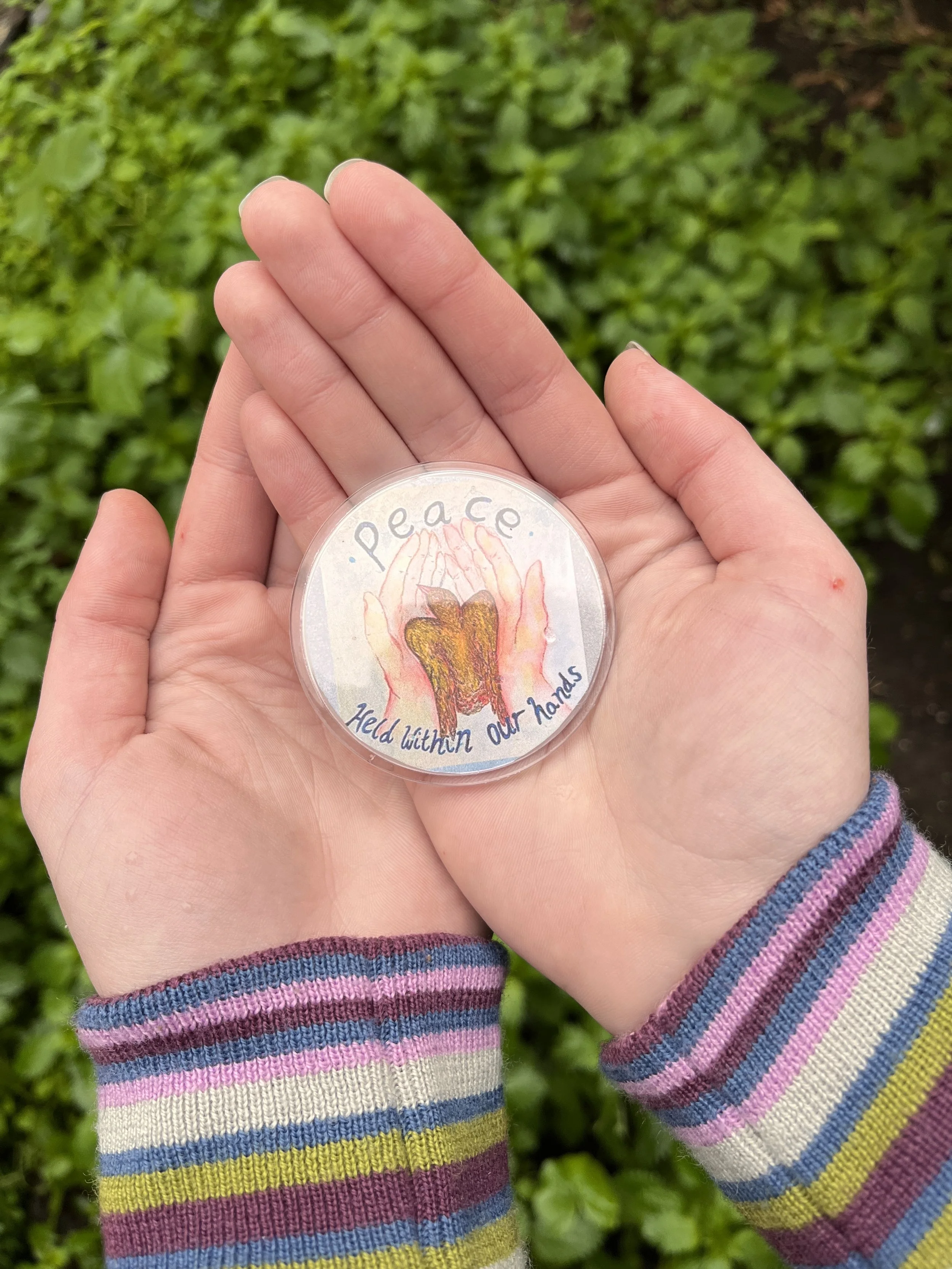 Peace Held Badge