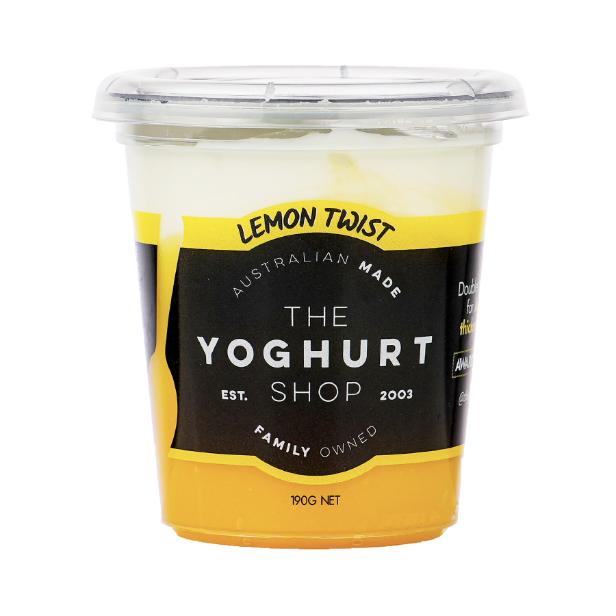 The Yoghurt Shop Lemon Twist yoghurt 190g tub, showing a distinct yellow lemon layer at the bottom and white yoghurt on top, with the product label visible.