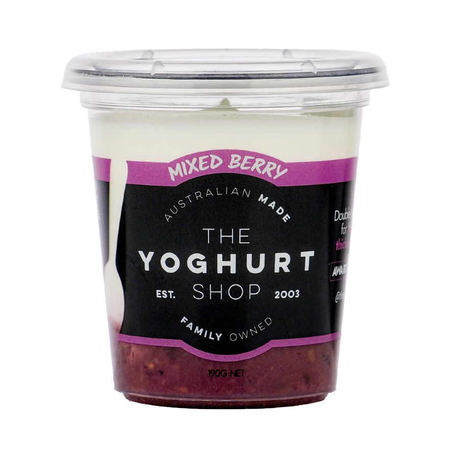 The Yoghurt Shop Mixed Berry yoghurt 190g tub, showing a distinct dark purple berry layer at the bottom and creamy white yoghurt on top, with the product label visible.