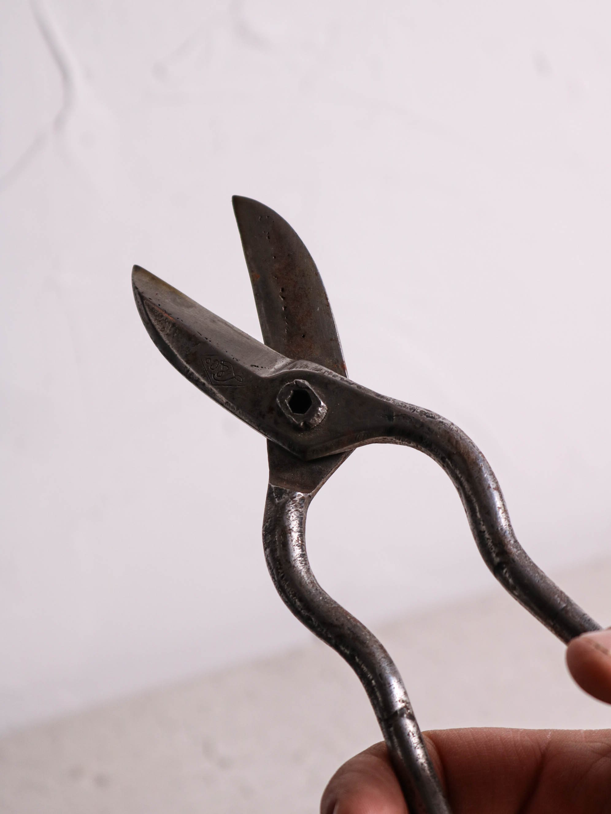 Fig. 15 Lindstrom & Co. trim shears. Hard-faced blades, forge welded serpentine stems, tapered handles.