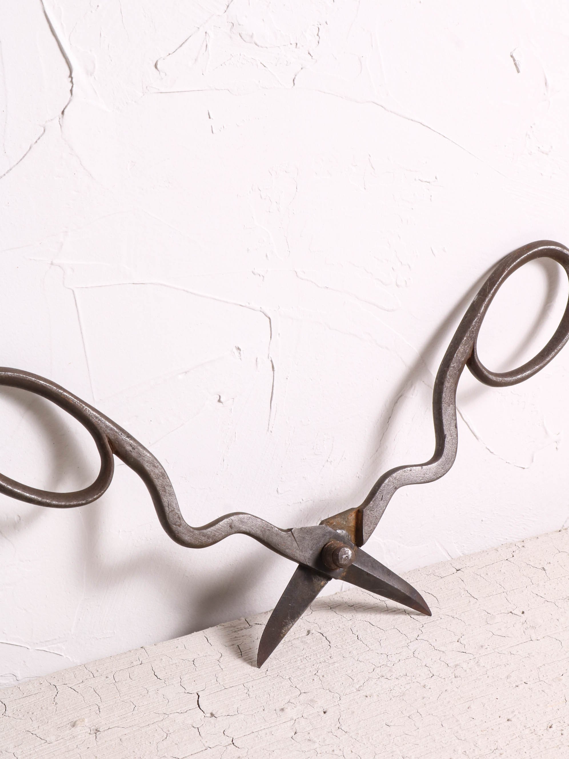 Fig. 1 Possibly English trim shears. Forge welded handles. Decorative bolt serpentine stems. Very detailed and exquisitely crafted. My guess is these are quite old. Based on some of my research these could exceed 200 years or more.
