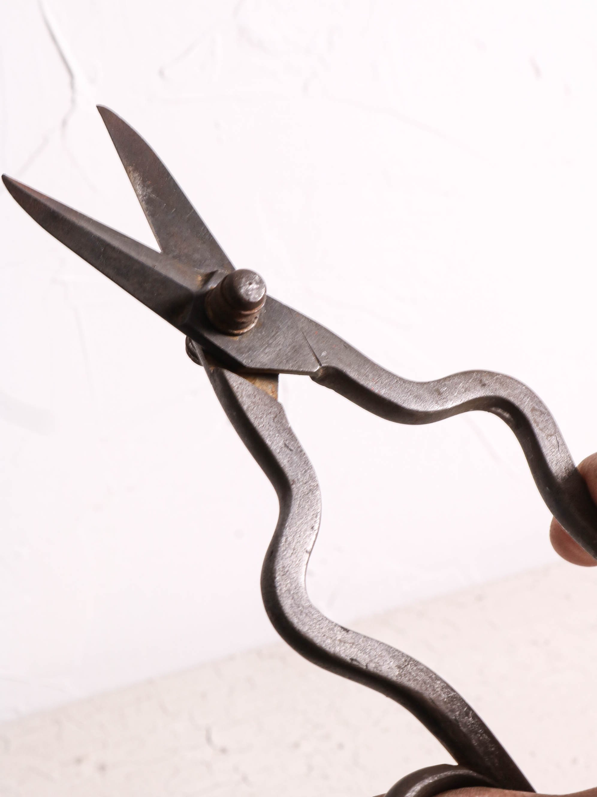 Fig. 1 Possibly English trim shears. Forge welded handles. Decorative bolt serpentine stems. Very detailed and exquisitely crafted. My guess is these are quite old. Based on some of my research these could exceed 200 years or more.