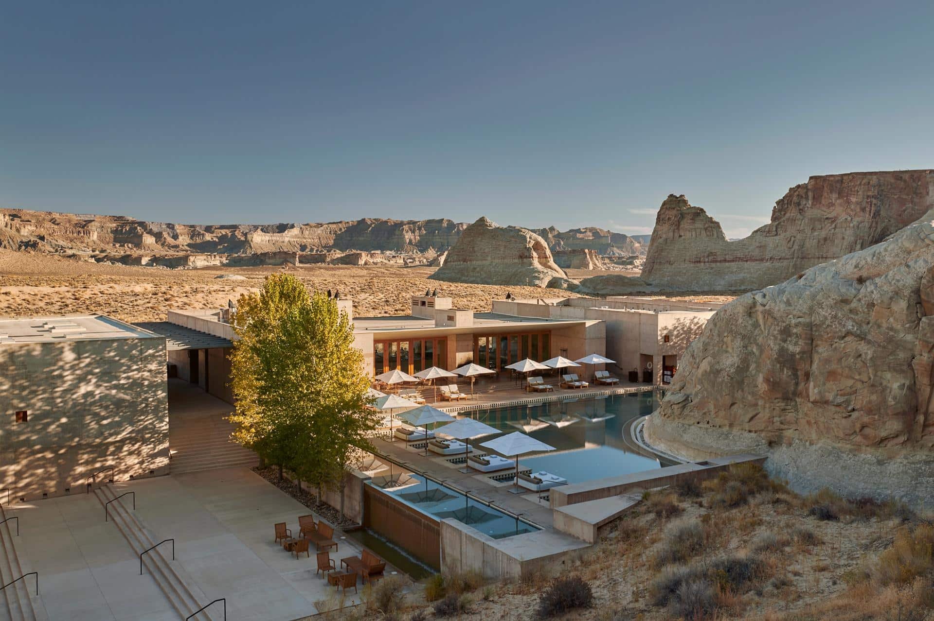 Desert hotel with swimming pool and rock formations