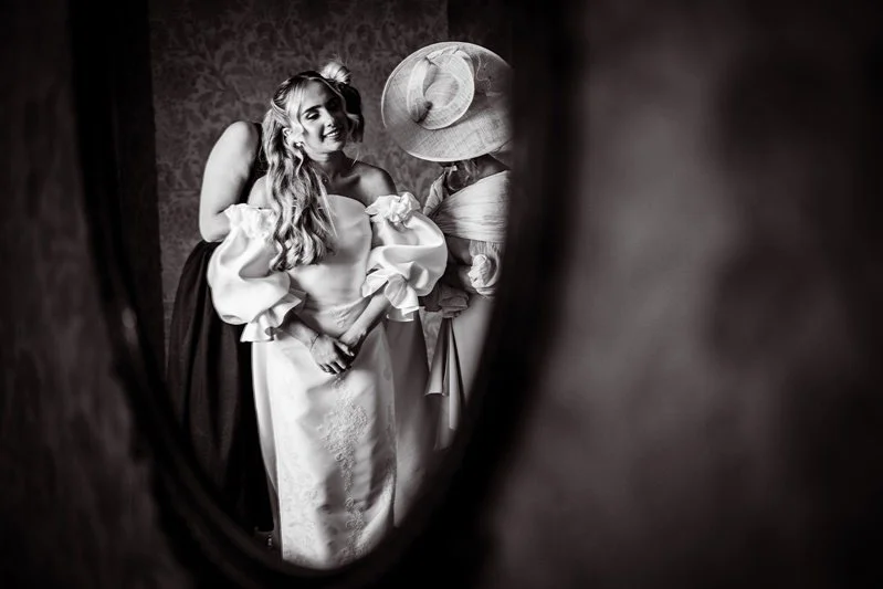 Black & White Portrait of the bride, Kat with her reflection in the mirror at Eastwell Manor, Kent