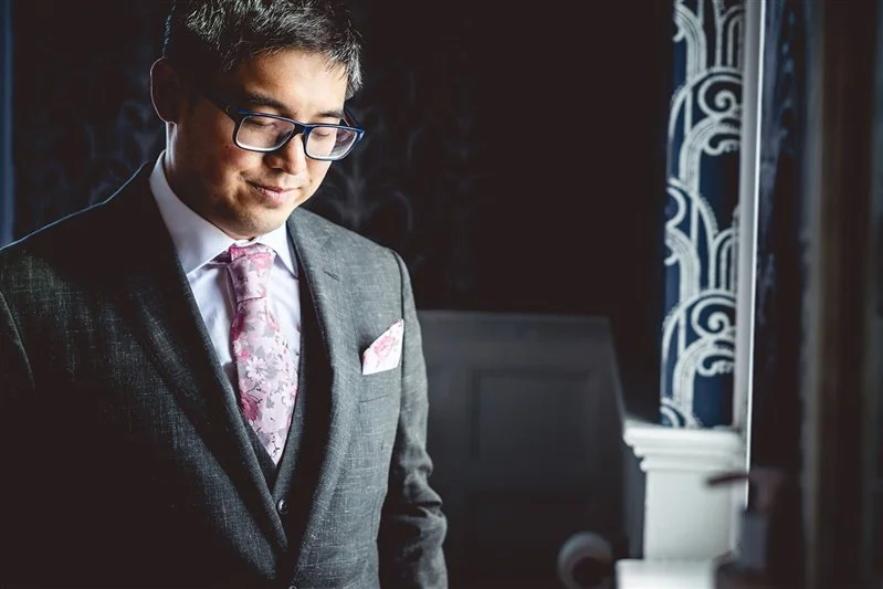 Colour portrait of the groom in window light at Highley Manor