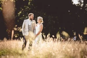 Colour photo of Bride and groom looking at each other.