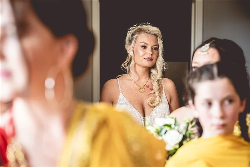 Colour photo of the bride waiting to walk down to the ceremony with her bridesmaids at The Darenth - Sevenoaks - Kent