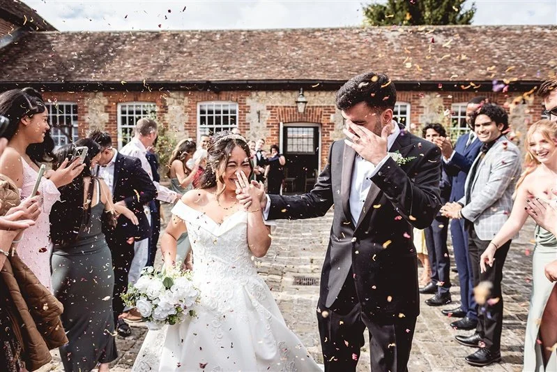 Bride and Groom and confetti at The Secret Garden - Ashford - Kent