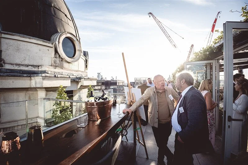 Colour photo of guests talking on top of the Wagtail Rooftop Bar & Restaurant of guests at the SEC event