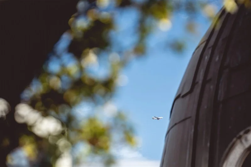 Colour photo of a commercial plane flying over the Wagtail Rooftop Bar & Restaurant - SEC event