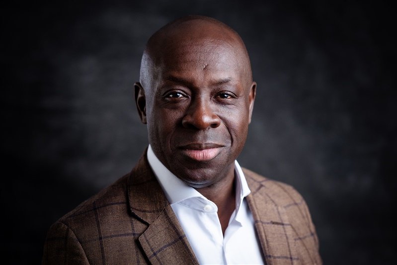 Black man wearing smart brown suit and white shirt - London Portrait Photographer Matt Rock