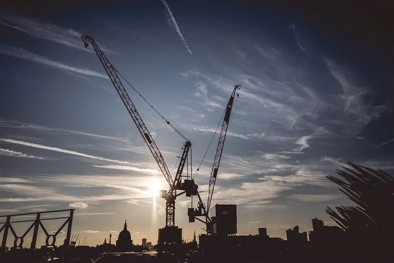 Colour silhouette photo on top of the Wagtail Rooftop Bar & Restaurant of the SEC event showing large cranes and St. Pauls in the background