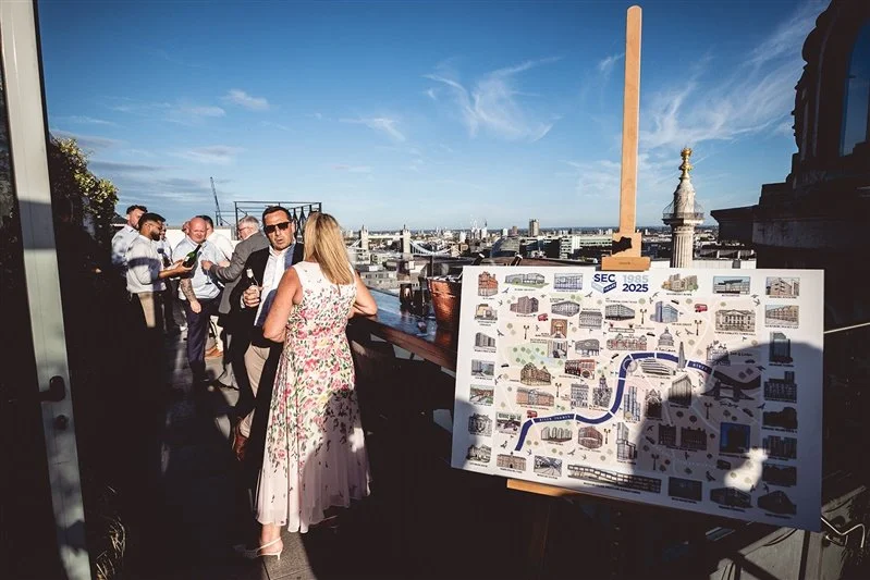 Colour photo on top of the Wagtail Rooftop Bar & Restaurant of guests of SEC