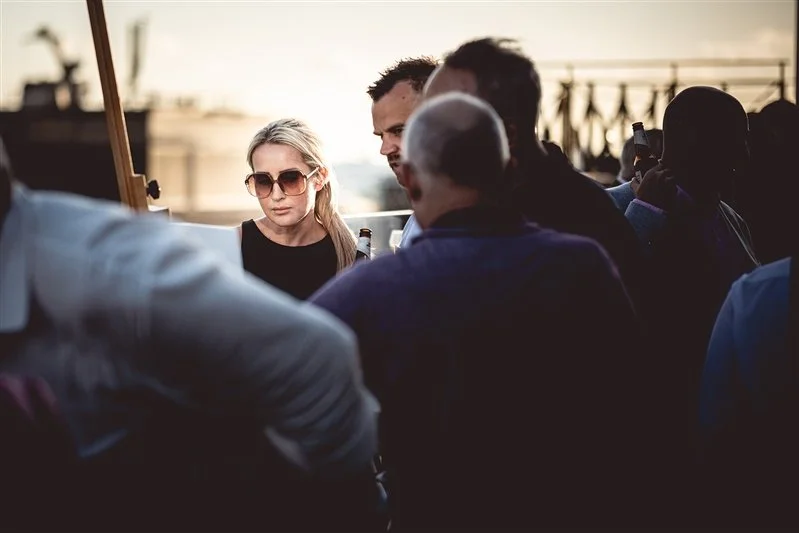 Colour photo of a guest looking at the design board on top of the Wagtail Rooftop Bar & Restaurant at the SEC event