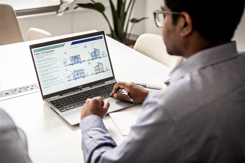 Commercial shoot of an office enviroment - a man working at the laptop
