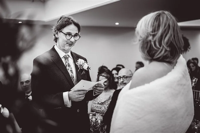 Groom reading his vows at the ceremony at Hayne House
