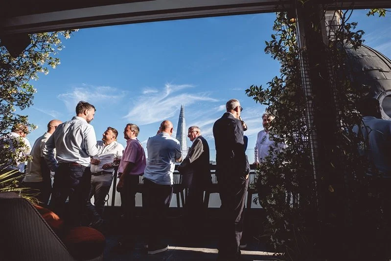 Colour photo on top of the Wagtail Rooftop Bar & Restaurant of guests of SEC