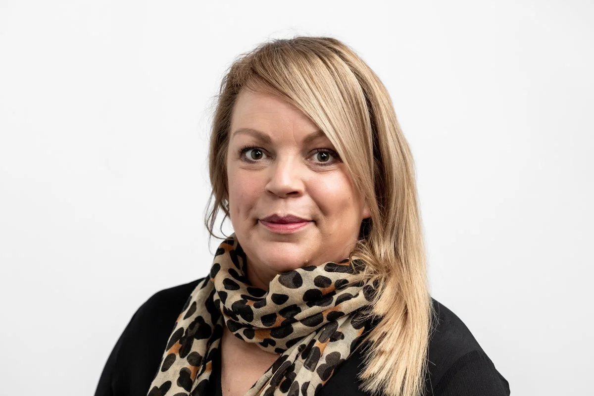 White woman wearing neck scarf and dark top - Cambridge Portrait Photographer Matt Rock