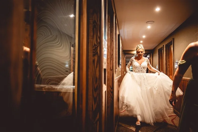 Bride walking through the corridor to get to the ceremony