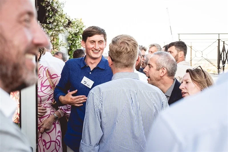 Colour photo on top of the Wagtail Rooftop Bar & Restaurant of guests of SEC