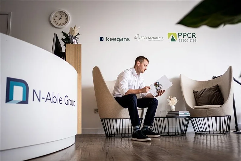 Commercial shoot for a London based surveyors - photo of an office environment - a man sitting in a waiting area of the office. 