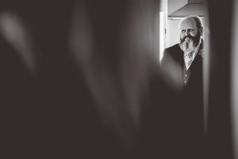 Black & White photo Father of the bride waiting to see his daughter for the first time in her wedding dress. The Oak Barn, Frame Farm.