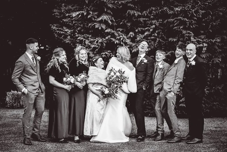 Group photo in black & white of the ushers and brides maids at Hayne house, Kent