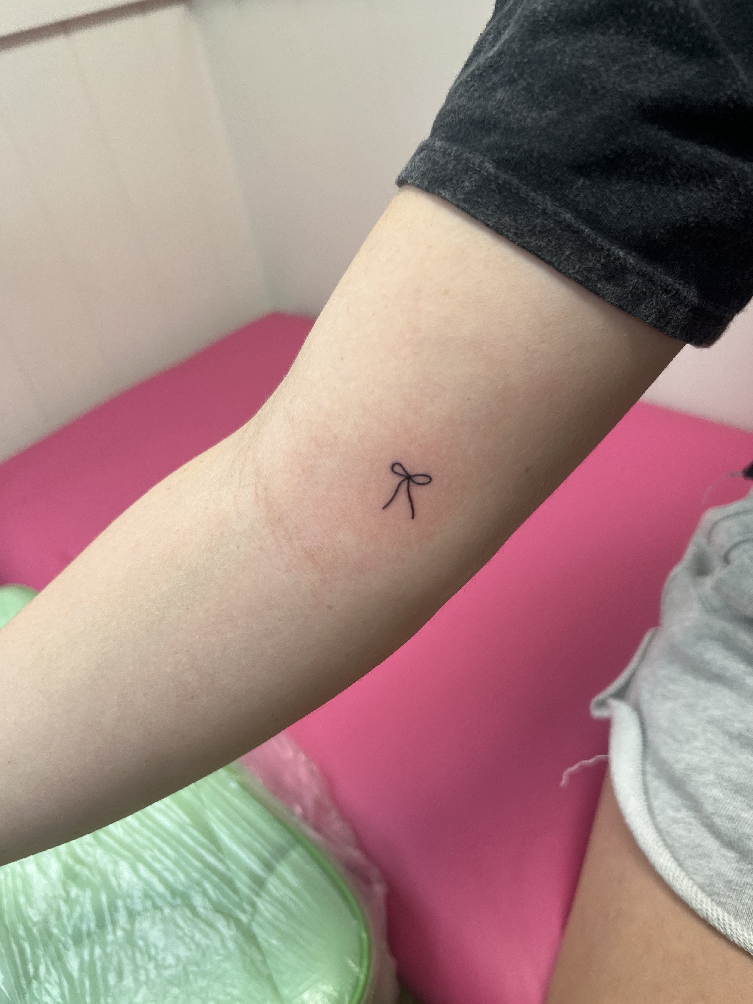 small dainty bow tattoo