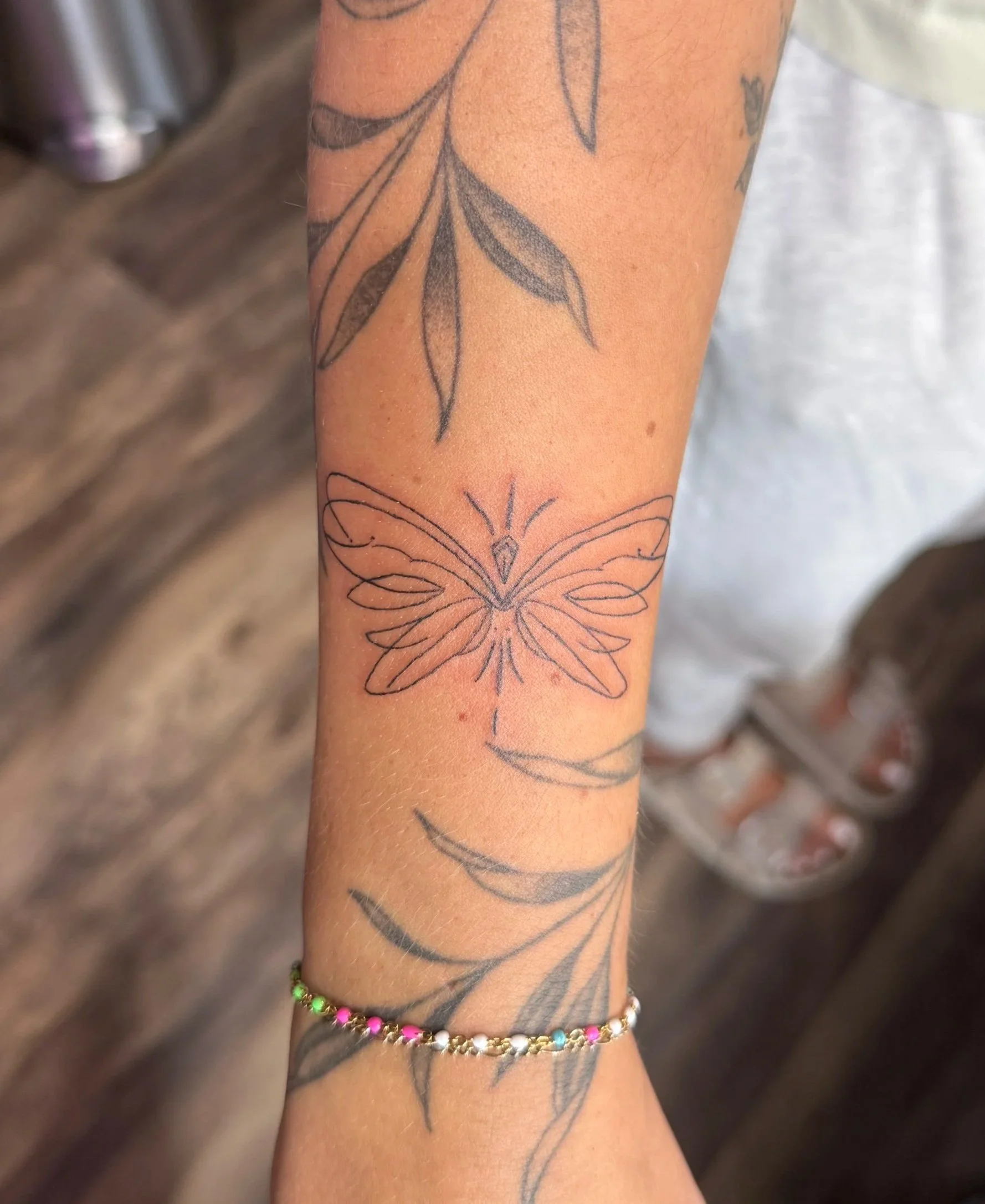 fine line dragonfly tattoo