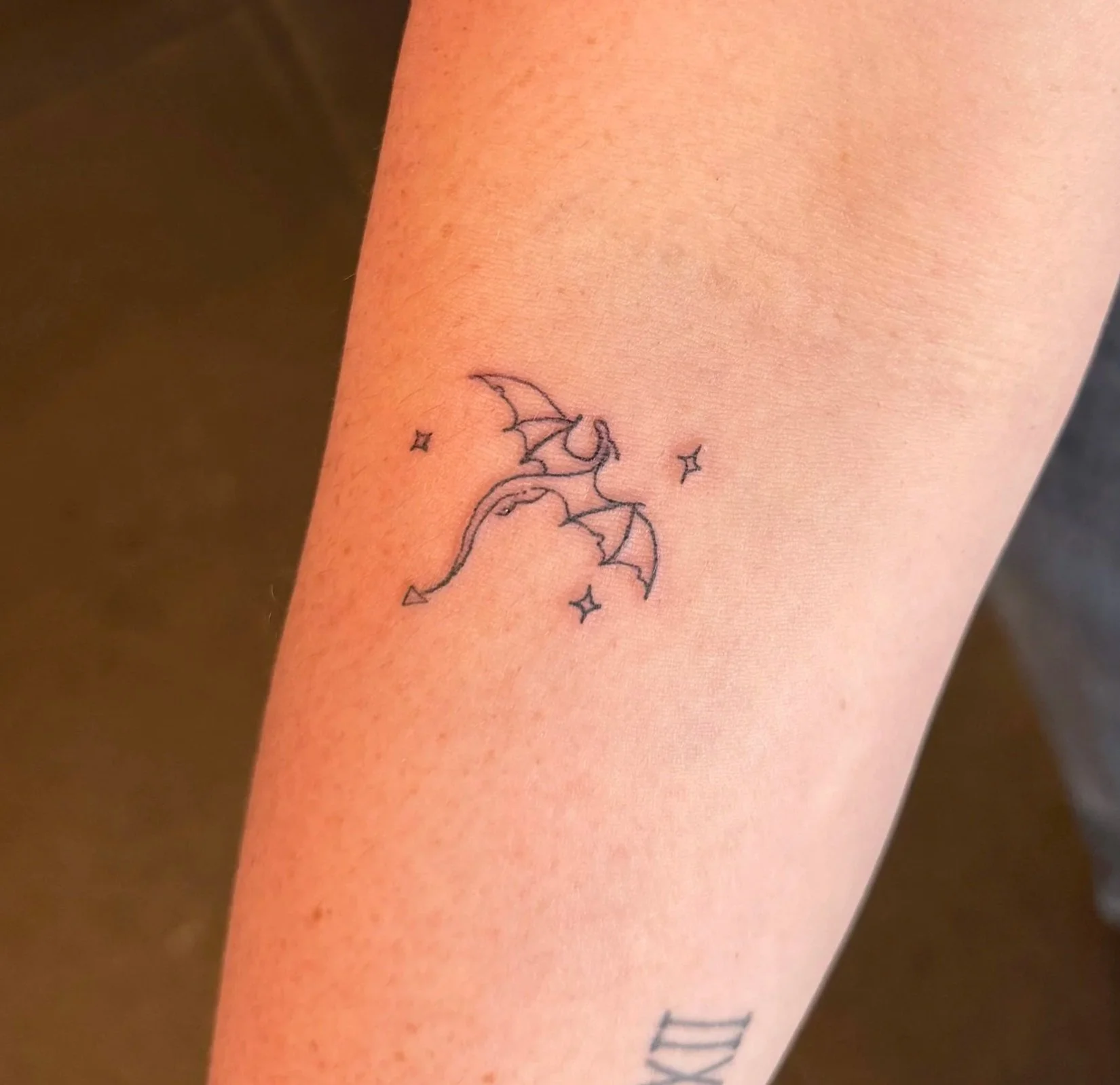 tiny dragon tattoo, fine line dragon tattoo