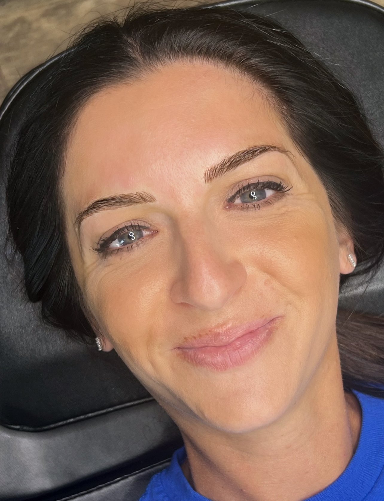 Freshly healed brows post-touch-up with softened pigment and natural fade.