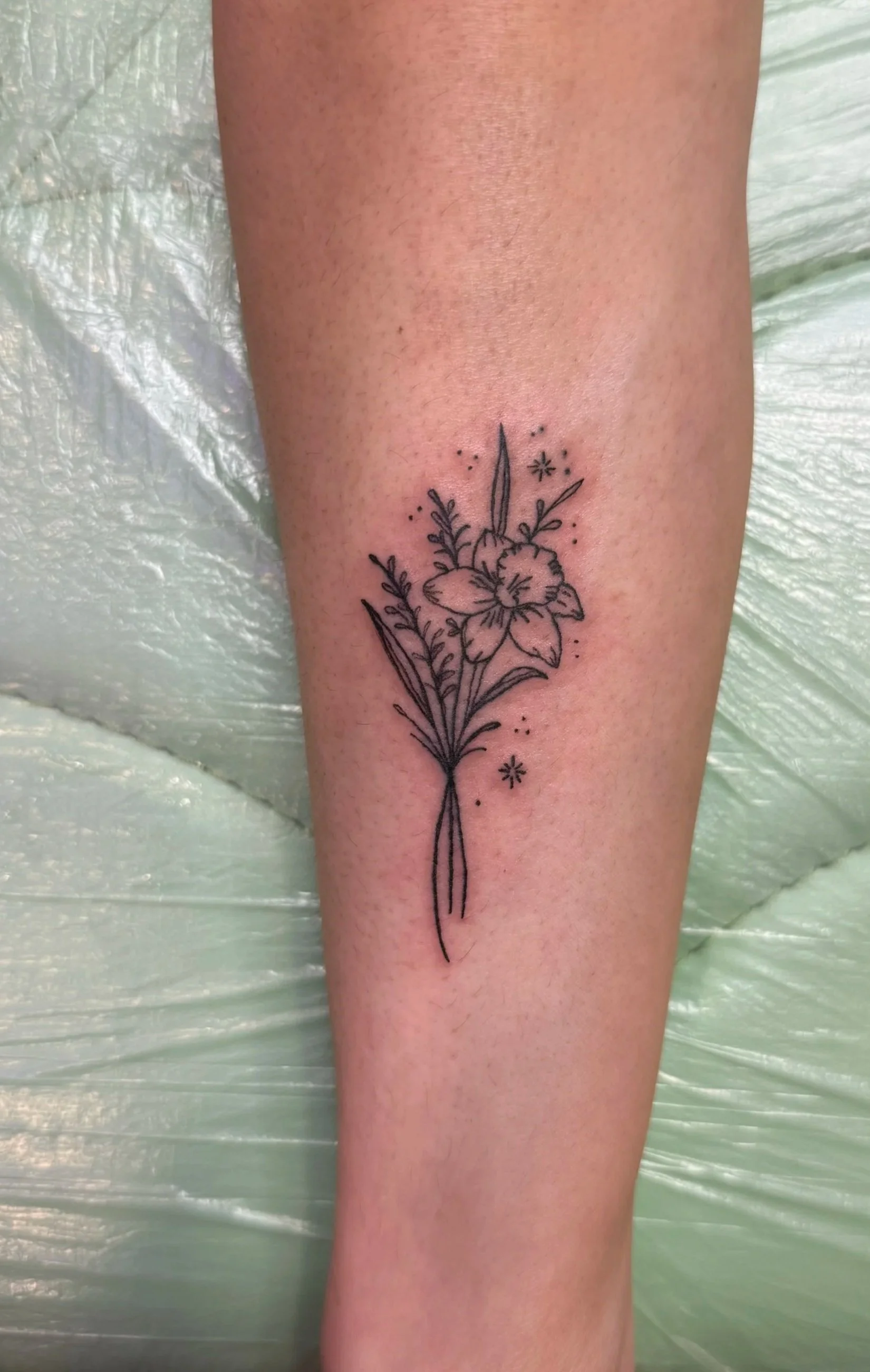 fine line daffodil tattoo
