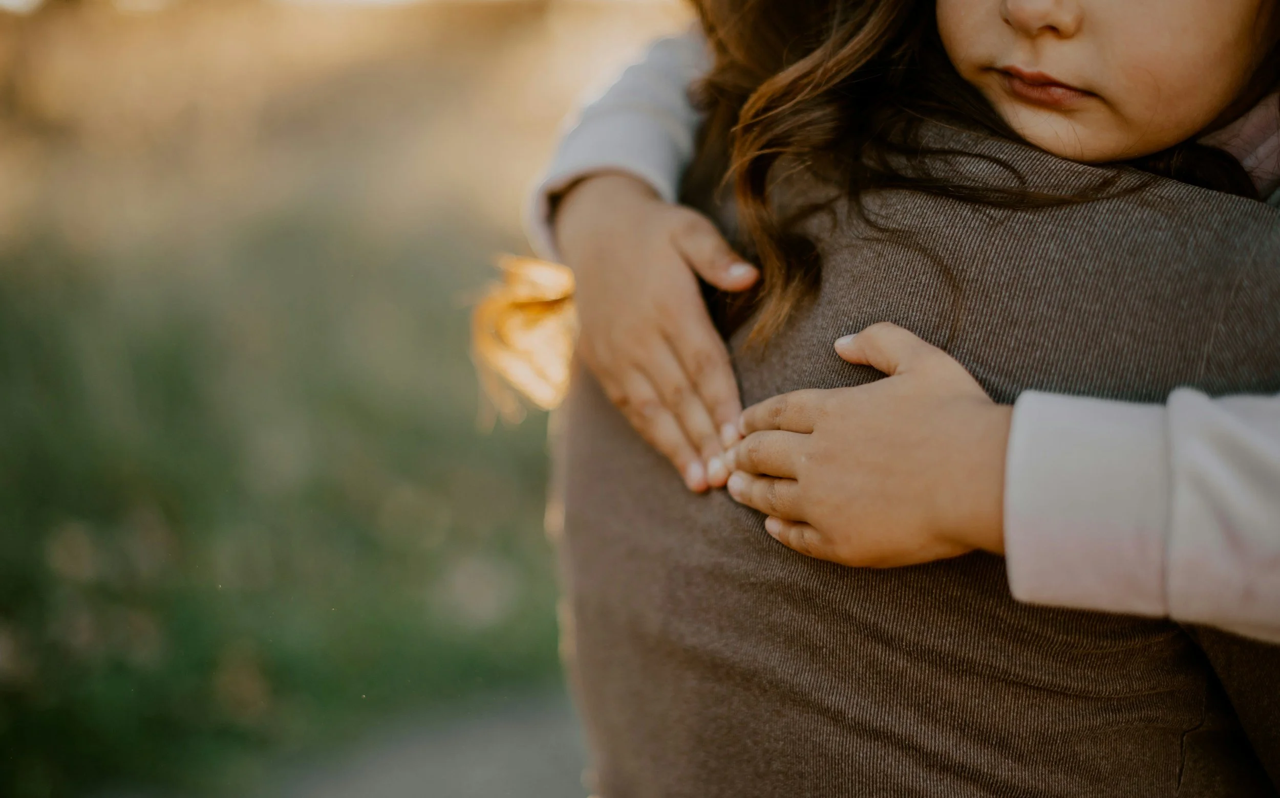 Caregiver and baby hugging
