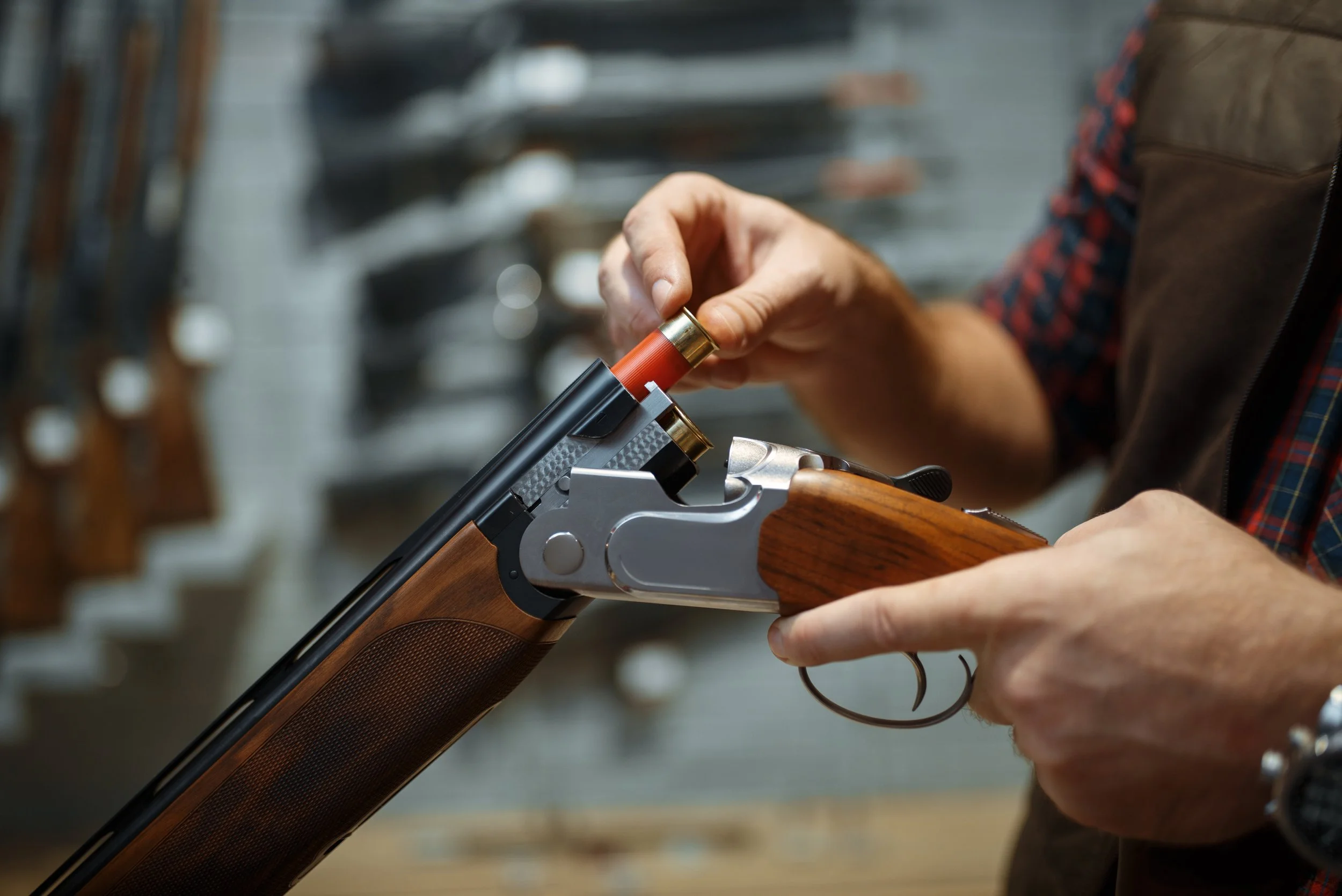 man-loads-a-rifle-gun-shop-interior-on-background-2024-12-05-16-00-43-utc.jpg