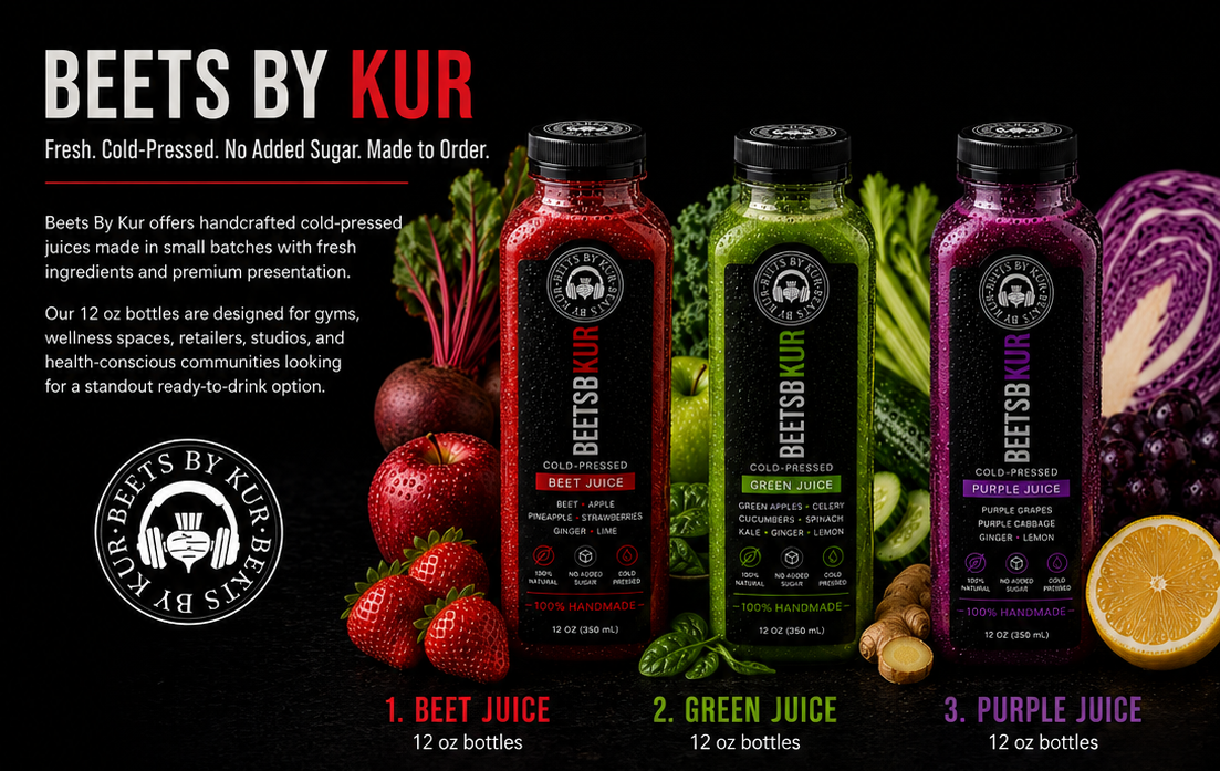 Display of three 12-ounce bottles of cold-pressed juice labeled Beet Juice, Green Juice, and Purple Juice, with fresh beets, apples, cucumbers, purple grapes, and citrus slices behind them.