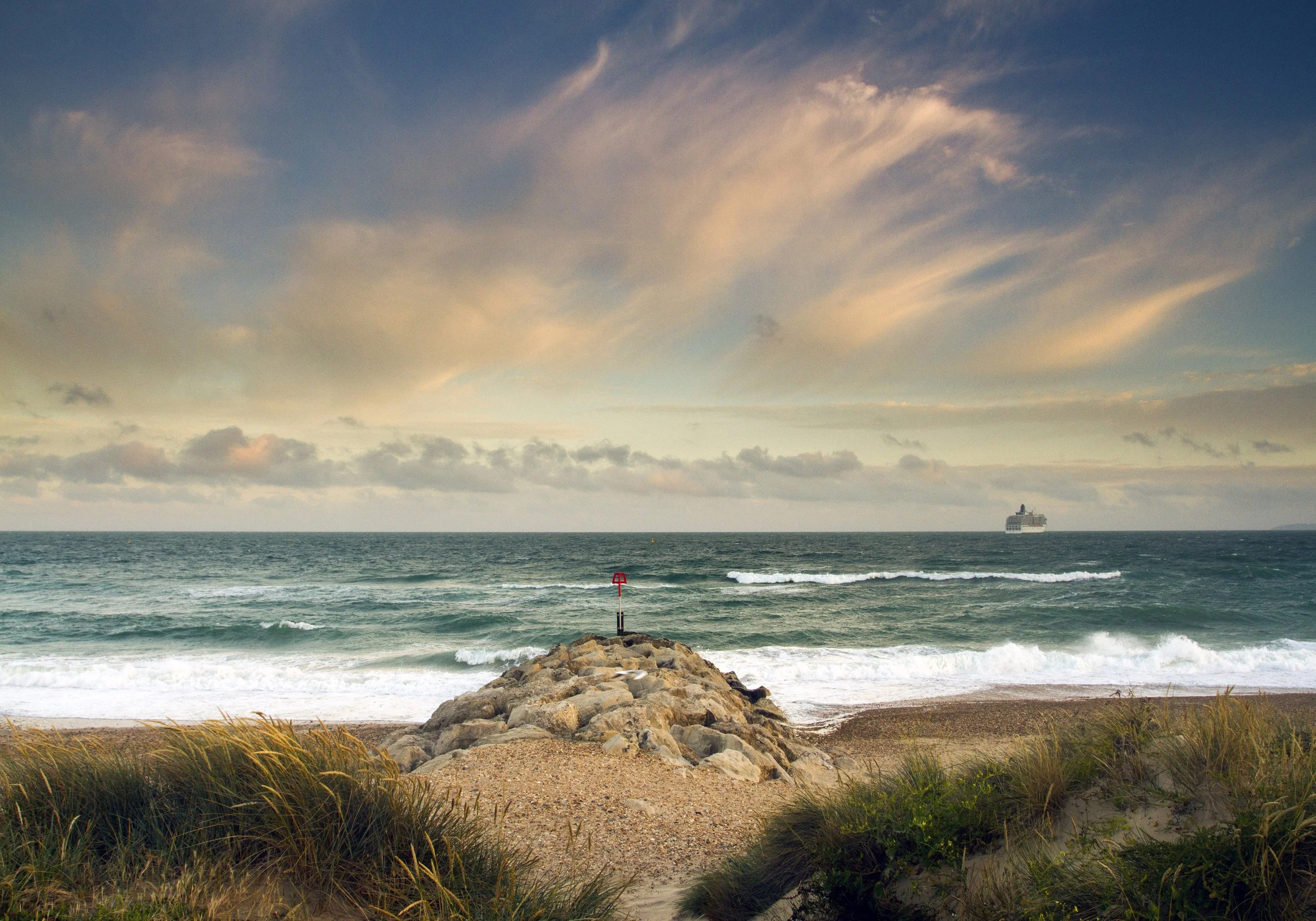 Whisper sunset clouds at Bournemouth beach