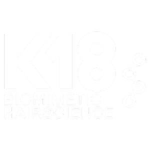 Logo for K18 Biometric Hairscience featuring bold white text on a black background with molecular graphic design element